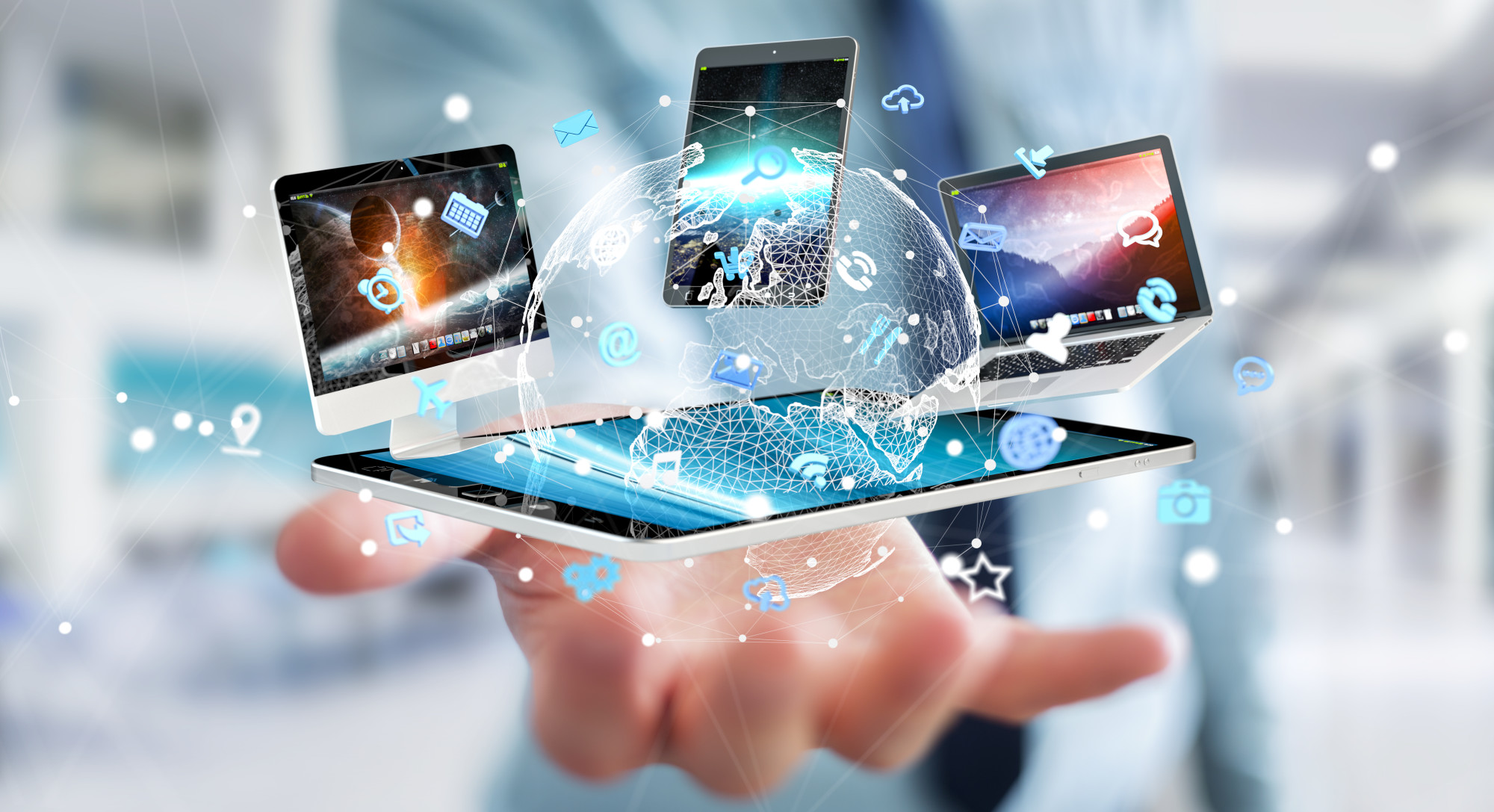 holograms of technology platforms emerging from a tablet in someone's palm
